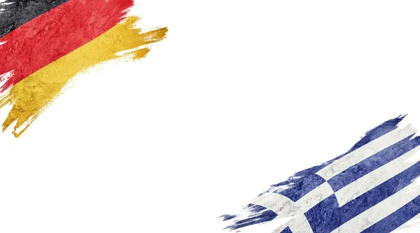 흰 바탕에 있는 독일 과 그리스의 깃발 — 스톡 사진
